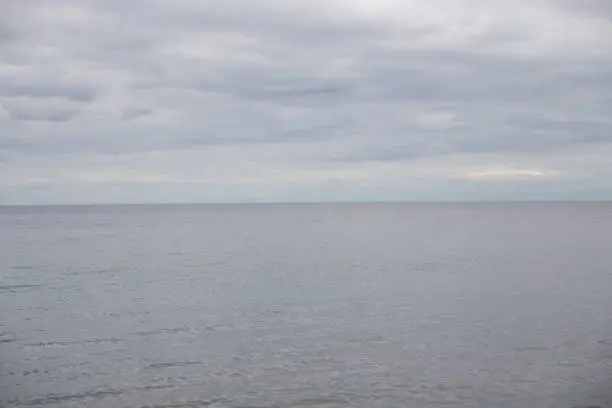 Photo of A view of Lake Ontario from a cottage. Peaceful summer sky and blue water.