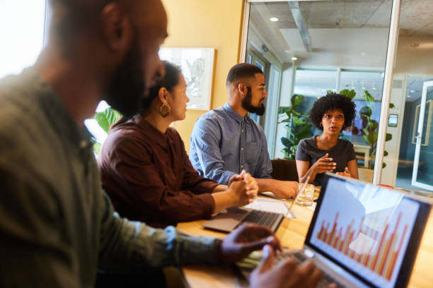 istock Diverse businesspeople discussing graphs during a board room meeting 1466719189