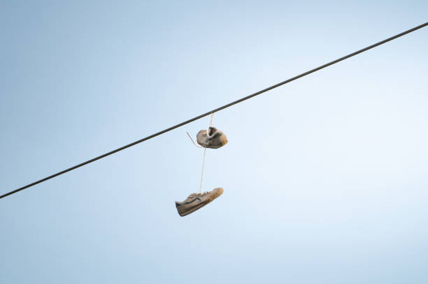 old shoes hanging on a rope