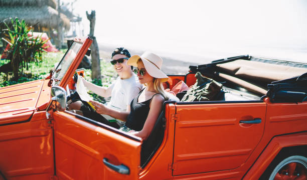 istock Couple with map in car during vacation 1466729442
