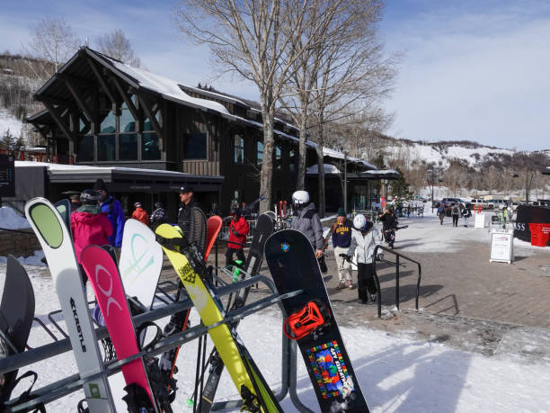 People preparing to ski or resting at the base of Buttermilk Ski Resort, Aspen, Colorado. Aspen, Colorado, USA- February 11, 2023: People preparing to ski or resting at the base of Buttermilk Ski Resort, Aspen, Colorado. buttermilk mountain stock pictures, royalty-free photos & images