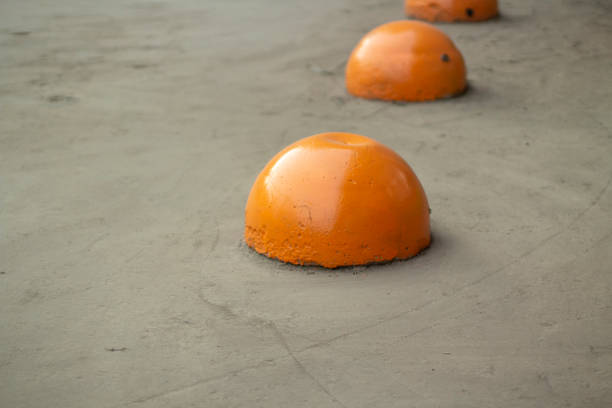 Parking areas. Orange spheres on road. Parking space closed. Motion Lock. Restriction for transport.