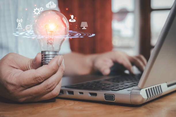 istock Businessman holding creative light bulb with innovative technology and marketing network icon on planning strategy solution of new ideas, modern business concept. 1466734692