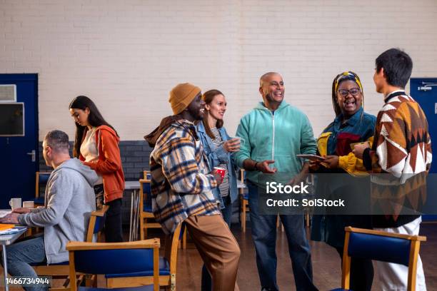 Catching Up With Friends At The Community Centre Stock Photo - Download Image Now - Employee, Connection, Volunteer