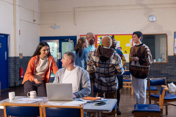istock Entering Details into Laptop at Community Centre 1466734945