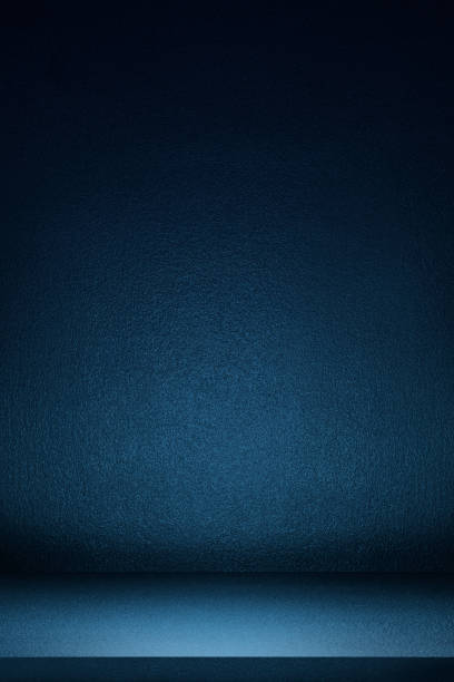 istock vertical image of Black and blue abstract cement wall and studio room, interior texture for display products. wall background. 1466735955
