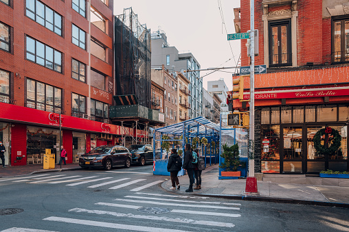 New York, USA - November 21, 2022: People walking in Little Italy, a neighborhood in Lower Manhattan in New York City, known for its large Italian population.