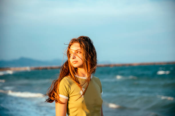 istock Girl Enjoying summer breeze 1466738436
