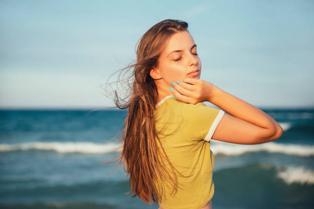 istock Attractive girl on beach wind 1466738442