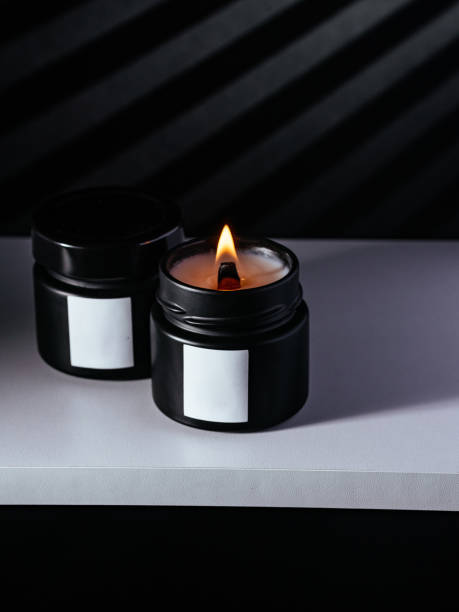 istock The candle is on a white shelf, black background with highlights 1466740541