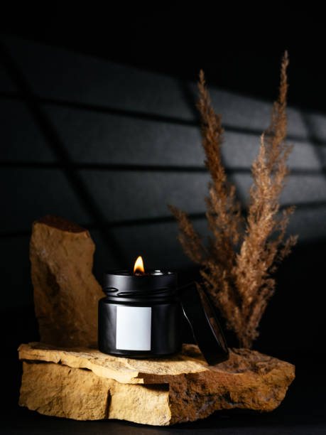 istock the candle stands on a composition of stones 1466740632