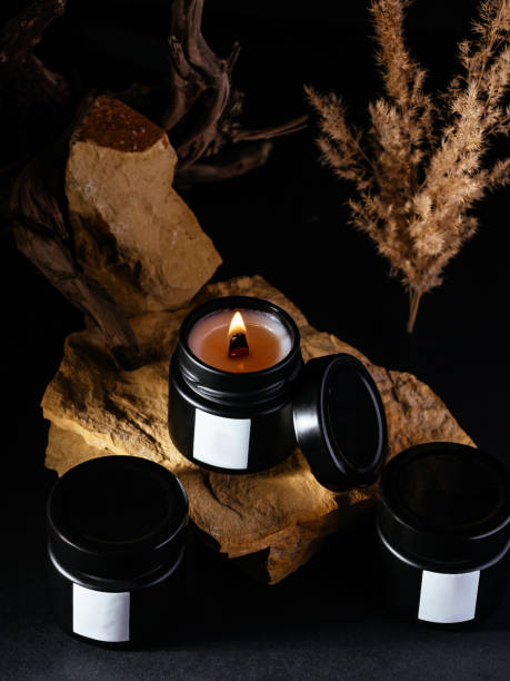 istock the candle stands on a composition of stones 1466740636