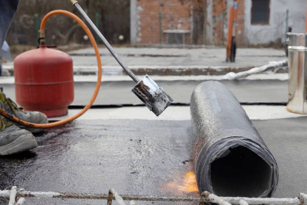 istock Laying Bitumen Insulation with Gas Blowtorch on a Concrete Slab 1466740692