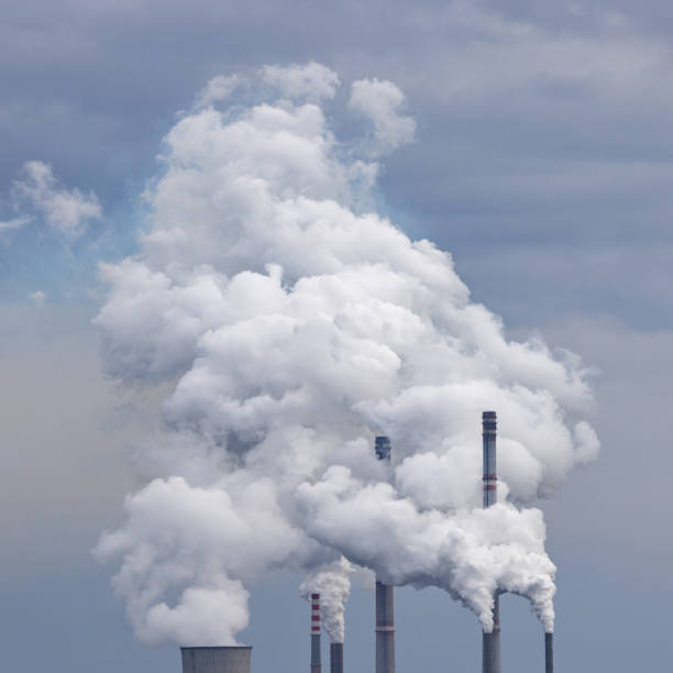 Clouds of Smoke from Factory Chimneys stock photo