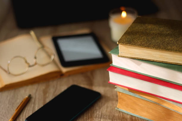 istock Books, Tablet, Glasses, Phone, Laptop and Candle 1466743341
