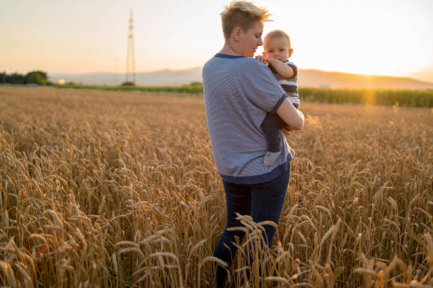 istock Mother and little son in a wheat field 1466743601