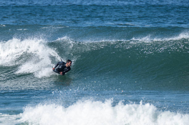 istock Bodyboarder surfing ocean wave 1466743820