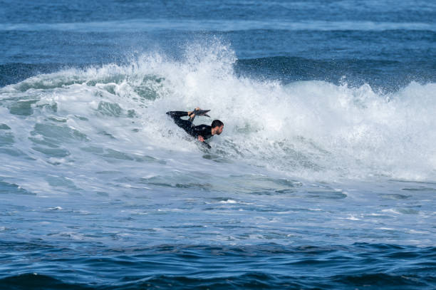 istock Bodyboarder surfing ocean wave 1466743892