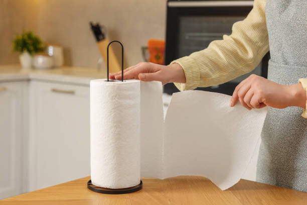 istock Woman using paper towels in kitchen, closeup 1466744887