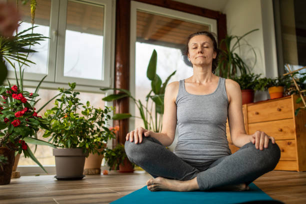 istock Woman doing some exercise at home 1466745110
