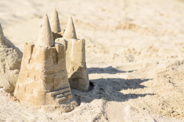 istock Beach with sand castle on sunny day. Space for text 1466745983