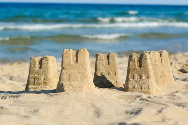 Beautiful sand castles on beach near sea