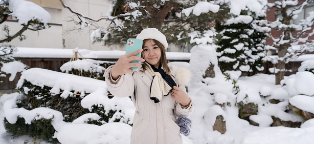 Young tourist Woman have fun traveling at Takayama city, Japan