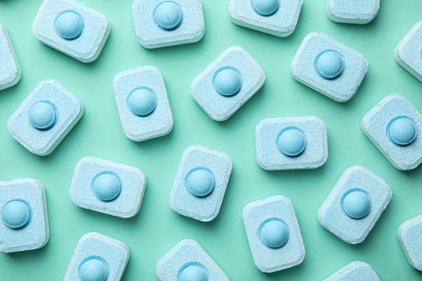istock Water softener tablets on turquoise background, flat lay 1466751276