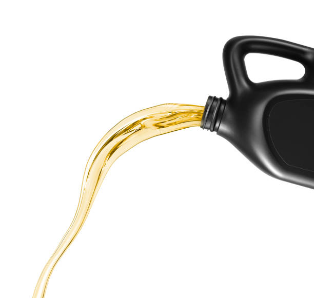 Engine oil pouring from canister, isolated on white