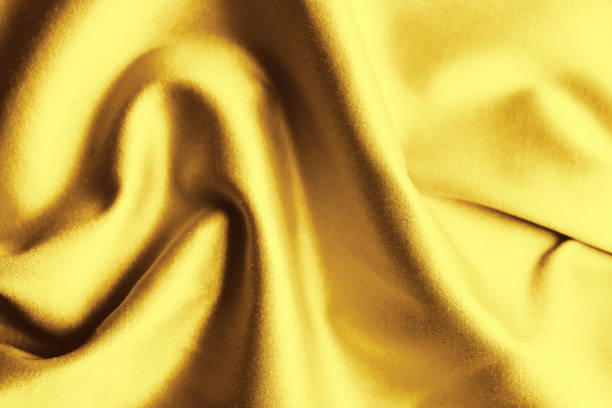 istock Texture of delicate golden fabric as background, closeup 1466751783