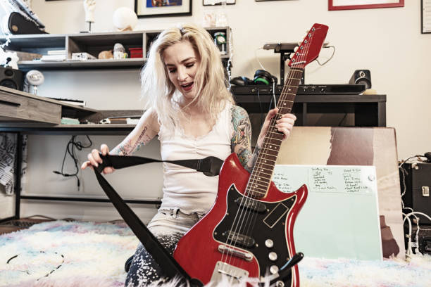 istock Female Musician practising at home 1466753183