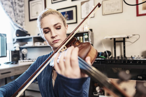 istock Female Musician practising at home 1466753444