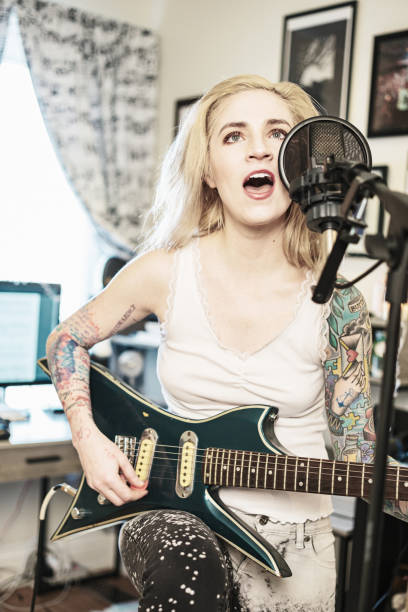 istock Female Musician practising at home 1466753810