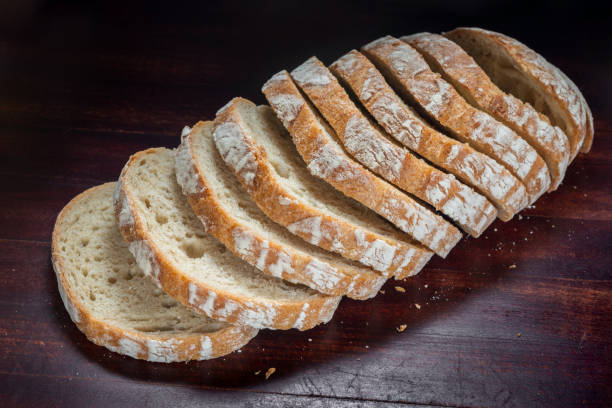 istock cutted rye round bread on wooden background top view 1466755111