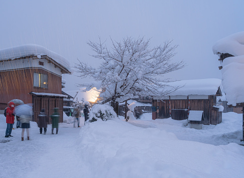 Shirakawago village with white thick snowing at night, the best for tourist travelling in Japan at winter