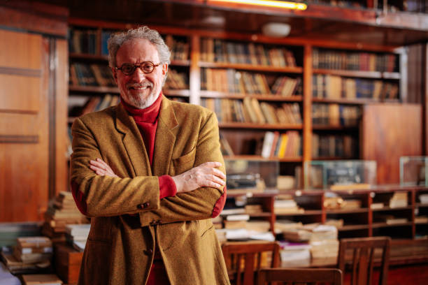 istock Portrait of university professor in library with copy-space. 1466756515