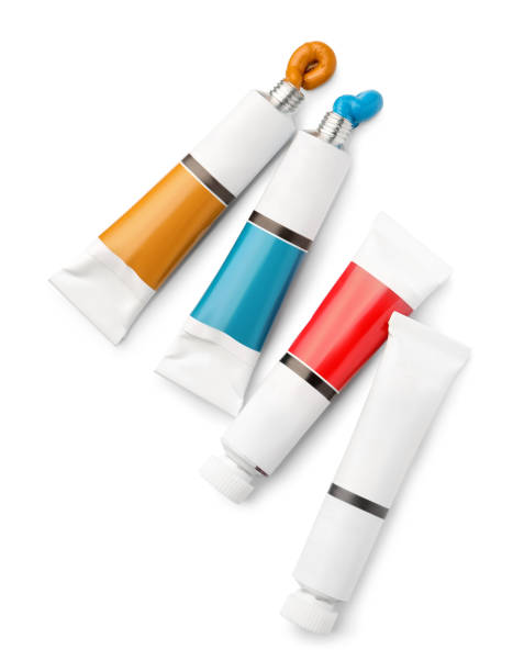 Tubes with oil paints on white background, top view