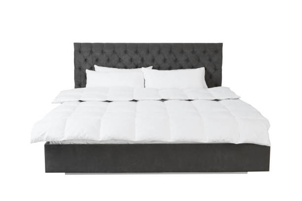 istock Elegant cozy bed with headboard, blanket and pillows on white background 1466757855
