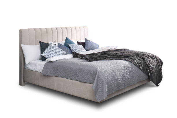 istock Elegant cozy bed with headboard, blanket and pillows on white background 1466757902