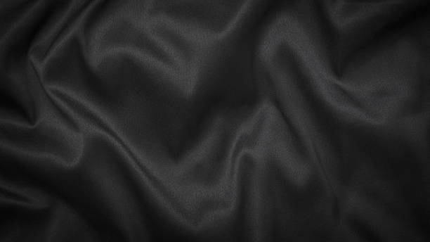 istock Black or dark gray with silk sheen wavy fabric texture background 1466758086