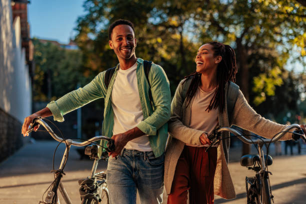 istock Smiling couple with bicycles outside. 1466759557