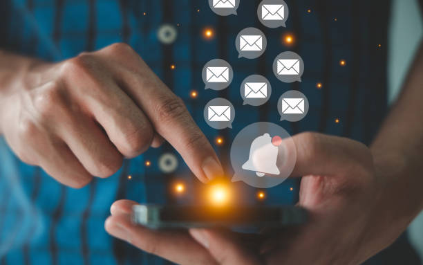 istock People sending and receiving email via smartphone. Electronic mail and notification on mobile phone concept. 1466759957