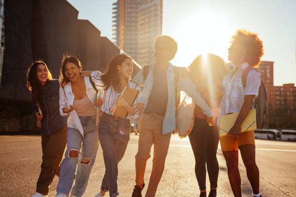 istock Cheerful students bonding in city. 1466761315