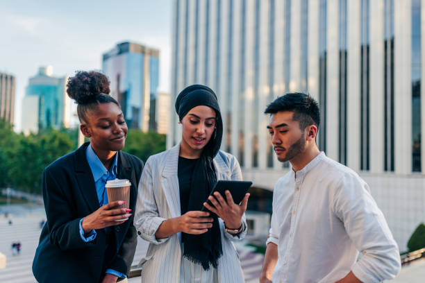 istock Entrepreneurs working on tablet outdoors 1466761758