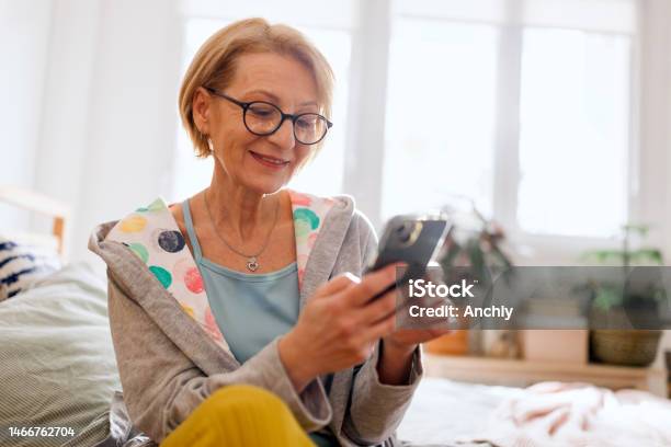 Woman Reads About Hormone Replacement Therapy Stock Photo - Download Image Now - Applying, Eyeglasses, Hormone