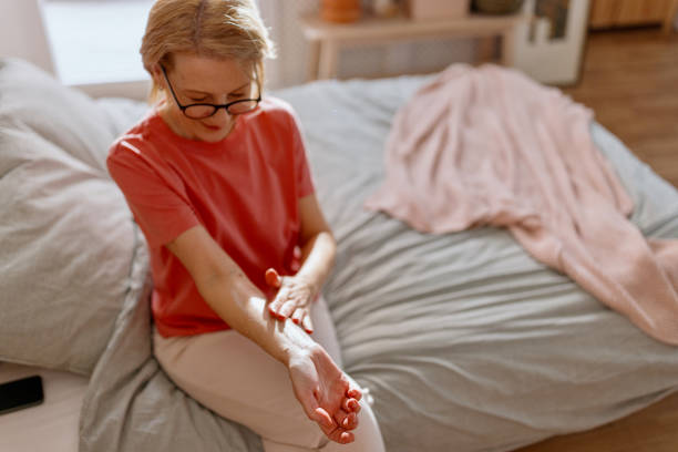 istock Mature woman applying estrogen cream on her forearm 1466762842
