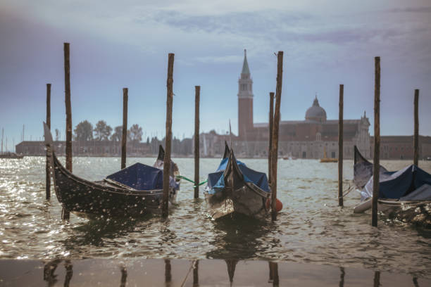 istock Gondolas moored on Grand Canal against sky at Venice 1466766357