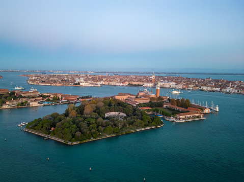 Drone shot of Venice islands with Church of San Giorgio Maggiore and St Mark's Campanile surrounded with seascape against sky in Italy