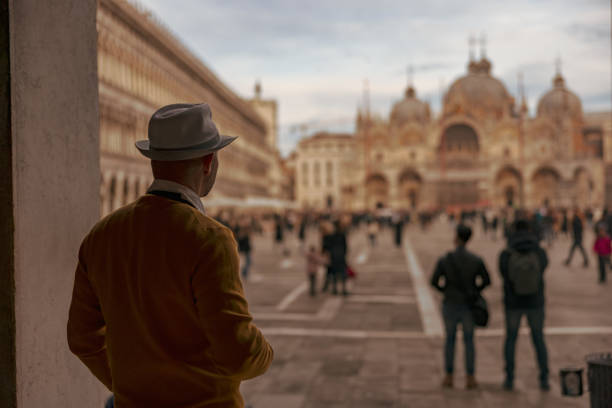 istock Tourist wearing hat looking at Saint Mark's Basilica in Venice 1466766831