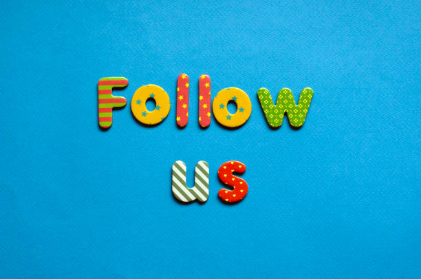 istock colored text follow us on blue paper background 1466768494